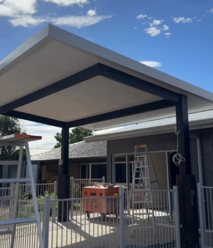 Flat roof pergola with steel posts and beams